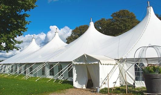 a row of portable restrooms placed outdoors for attendees of a special event in Bally PA